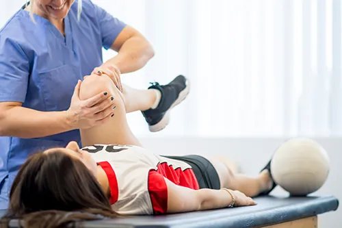 Chiropractor helping an athlete with a sports related injury